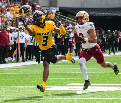 Luther Burden trying to catch a pass